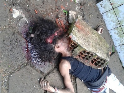 Brazilian street hoe stoned to death 