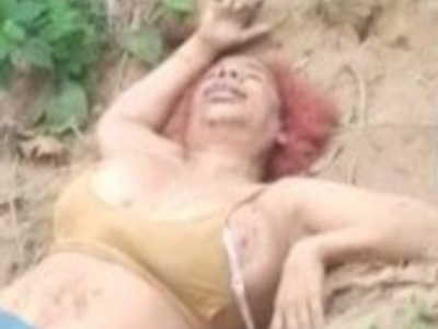 Busty woman executed and buried in shallow grave