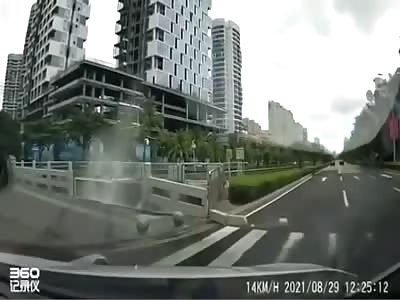 Tesla crashes through barrier into water.