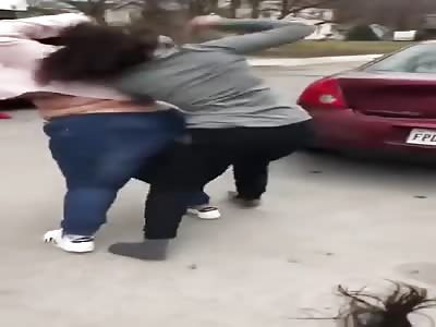 Women fight over a loaf of bread