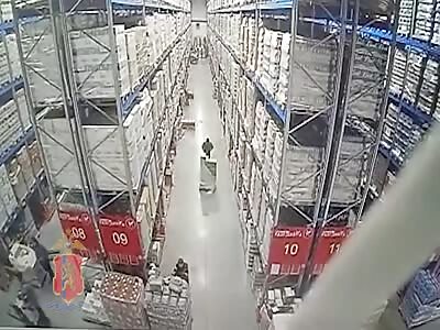 Warehouse Worker Buried Under Massive Stacks of Alcohol 