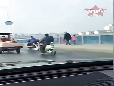 Chinese man drags wife.