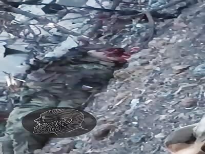 Ukrainian soldier shows two dead Russian soldiers
