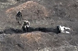 Ukrainian drone drops a grenade onto a Russian position