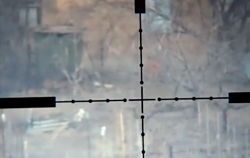 A Ukrainian sniper fires on Russian soldier
