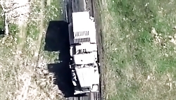 UA drone drops a munition onto a moving RU BM-21 Grad truck