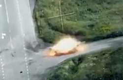 Russian soldiers crossing the road are hit by an explosion