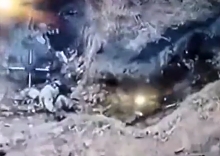 Ukrainian drone pans over a trench with multiple Russian KIA