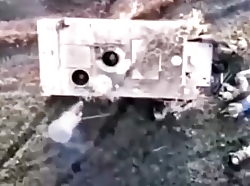 Russian drone dropping grenade in to open hatch of M113