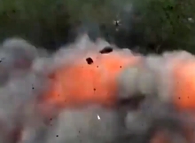 UA combat drone completely destroys a RU munitions pile with a grenade