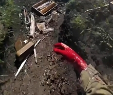 UA soldier is wounded in a trench and gets help being bandaged