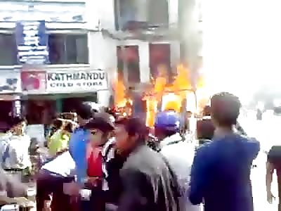 People jumping from burning building.