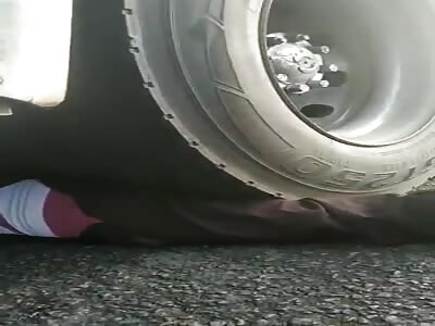 Live victim crushed in truck wheels