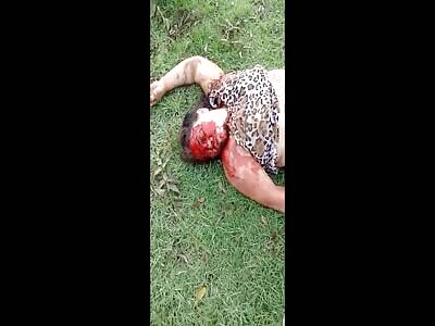 Woman with bloodied face victim of accident in a mud