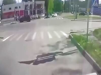 Motorcyclist lands on cars.