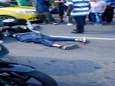 Motorcyclist crushed by truck.