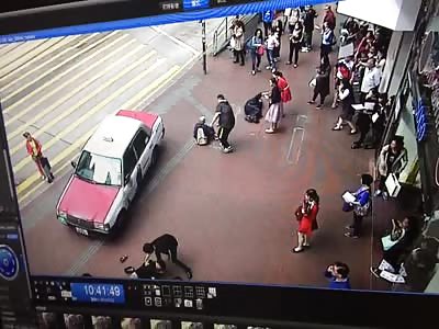 Driver only checks damage of his taxi after a serious accident