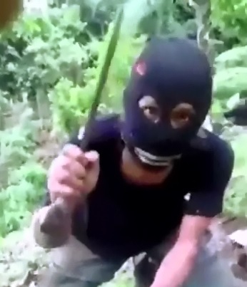Butchered like a Side of Beef..Man is Partially Beheaded with Machete by a Masked Mystery Man 