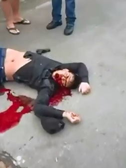 Man takes his Final Gasps of Blood before Dying on the Concrete 
