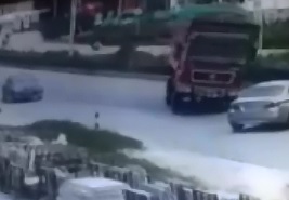 Dump Truck Driver loses Balance and Dumps his Full Load on top of Little Car 