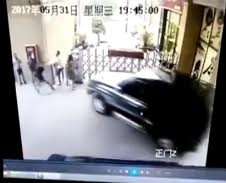 Brutal...Woman being crushed against wall by crazy driver