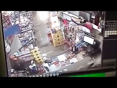 Store Owner in Pink Shirt takes Fatal Head Shot during Struggle of Robbery 
