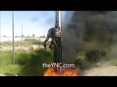 Burning Headless Man (ISIS) is Hanged from Pole 