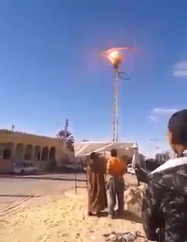 Crazy Man Commits Suicide by Electrocution on Live Wired Pole (New Angle)