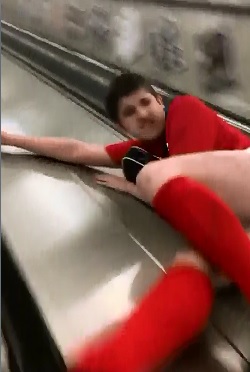 Moron almost Kills Himself Sliding Down Escalator 