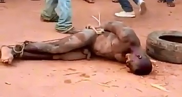 Brutal Beating and Man Set on Fire..Gets Beating from Everyone 