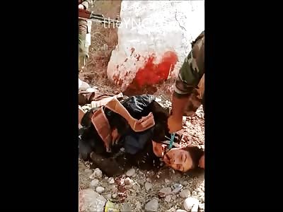 Iraqi Troops Mutilate what looks to be a Kid....BRUTAL 