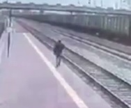 Dude Darts Head First Under Train to Commit Suicide 