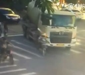 Cyclist being crushed by cement truck