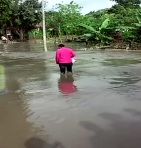 Woman in Pink is Swept away Almost Drowns but is Saved by Hero Kid