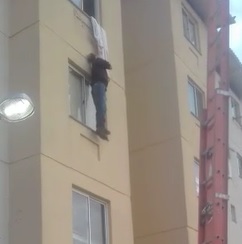 WTF Dude Hanging Out his Window by a Bed Sheet Drops to Ground