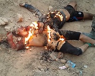 Two ISIS Terrorists Burned and Stoned to Death .