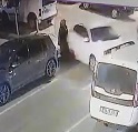 Woman Crushed Between Two Cars