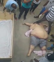 Coordinated Town Effort to Get Dead Fat Man in a Box