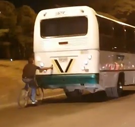Moron Catching a Ride on a Bus... What Could go Wrong?
