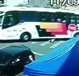 Pedestrian Swallowed by Turning Bus