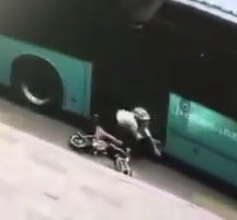 Small Woman on a Tiny Motorcycle Eaten by Big Bus