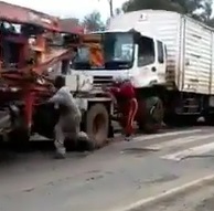 Man in Hurry to Hitch Ride on Truck Gets Flattened.