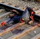 DAMN: Dude Still Squirming Alive on the Train Tracks