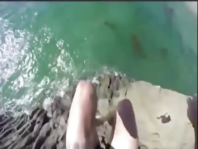 GUY JUMPS FROM A CLIFF AND JUST MISSES ROCKS, FROM HIS POV