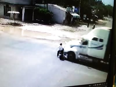 Motorcyclist hit by a huge truck