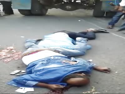 Two dead men crushed by a truck