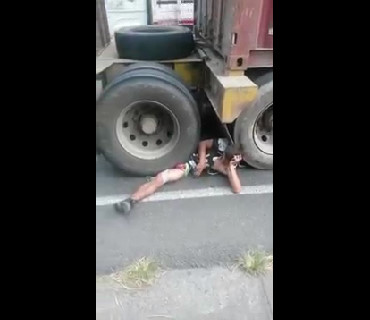 Guy Waits Calmly For Help With His Penis Crushed Under the Truck Wheel
