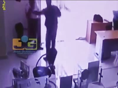 SECURITY GUARD IS SHOT IN ROBBERY