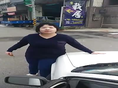 ANGRY WOMAN DESTROYING CAR