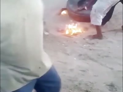 MAN BEING BURNING IN AFRICA